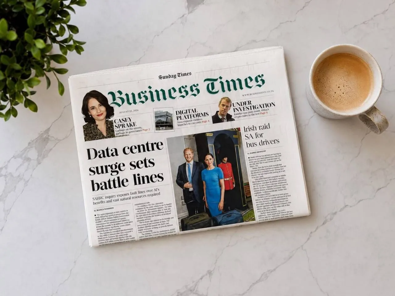 The Sunday Times Business section with Casey Sprake's column, on a marble table beside a coffee